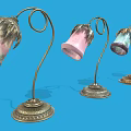 Artistic Table Lamps With Curved Metal Stems And Colorful Glass Shades
