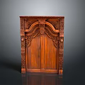 Antique Wooden Cabinet With Intricate Carved Details And Double Doors