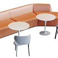 Public Chairs With Curved Sofa And Round Tables In Gray And Orange Colors