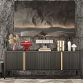 Dark TV Stand with Gold Accents against Stone Wall with Wall Art and Decorative Items