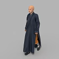 Bald Man in Full Length Dark Blue Robe Standing Against Gray Background