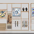 Elegant Display Space With Golden Frame Racks Colorful Scarves Decorative Paintings And Black Vases