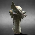 Ancient Bronze Mask Sculpture With Unique Facial Features And Ear Design