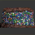 Delicious Round Chocolate Cake With Rich Frosting And Colorful Sprinkles
