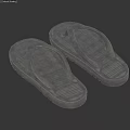 A Pair of Gray Flip Flops Isolated on White Background with Textured Soles