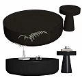 Dark Round Coffee Table With Plants Books And Side Tables