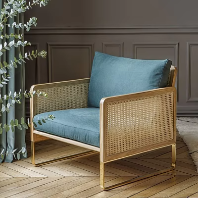 Stylish Rattan Leisure Chair With Blue Cushion Gold Frame And Green Plants 3d model