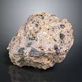 Natural Decorative Stone with Rough Surface Mixed Colors and Visible Mineral Inclusions