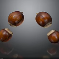 Four Shiny Brown Chestnuts Floating On Black Background With Reflections