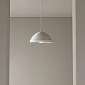White Textured Pendant Light With Minimalist Design Hanging In Light Colored Interior
