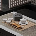 Traditional Chinese Tea Set With Teacups Saucers And Pastries On Bamboo Mat
