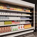 Black And White Commercial Refrigerator Display Cabinets With Glass Doors Holding Various Bottled Beverages