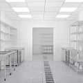 Modern Commercial Kitchen With Stainless Steel Worktables Cabinets And Ventilation