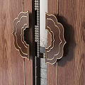 Elegant Traditional Brass Door Handle With Carved Patterns On Wooden Door