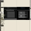 Modern Kitchen Interior Featuring Built in Ovens With White Cabinets Digital Displays And Racks
