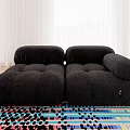 Black Plush Double Sofa In Modern Living Room With Colorful Area Rug