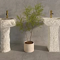 Two Textured Stone Washbasins With Golden Faucets And Potted Tree Against Gray Wall