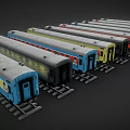 Colorful Model Train Cars in Various Colors Parked on Tracks with Windows