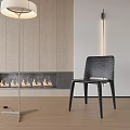 Black Textured Single Chair In Modern Living Room With Fireplace Floor Lamp And Wooden Wall