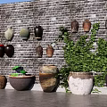 Brick Feature Wall With Hanging And Standing Ceramic Jars And Green Foliage 3d model