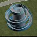 Blue Spiral Road Facility With Green Lawn And Trees Under Clear Sky