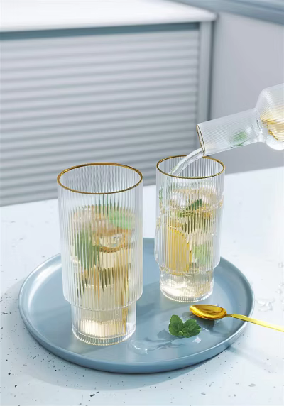 Clear Gold Rimmed Glasses With Ice Cubes Lemon Slices Mint Leaves On Light Blue Tray 3d model