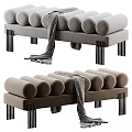 Modern Bed Bench With Cylindrical Cushions Gray Brown Metal Legs And Draped Blanket