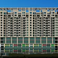Modern High Rise Office Building With Glass Curtain Wall And Retail Spaces At Base