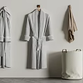 Cozy Soft Gray Robes Hanging On Wall With Beige Laundry Basket