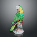 Green And Yellow Parrot Ceramic Figurine Perched On Decorative Base With Red Accents
