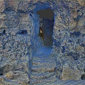 Scenic Rocky Cave Formation With Pathway And Arch