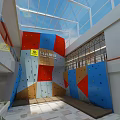 Indoor Climbing Gym with Colorful Wall Reception Desk Tile Floor and Plant