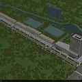 Scenic Commercial Street With Lush Greenery River And High Rise Buildings