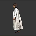 A Man Wearing Full Length White Robe Standing Against Gray Background