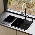Black Double Bowl Kitchen Sink with White Faucet on Countertop and Natural Light