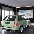 Light Green Range Rover SUV Rear View In Modern Indoor Showroom With Billboard