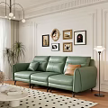 Modern Green Leather Three-Seater Sofa With Wall Decorative Paintings Floor Lamp And Palm Plant