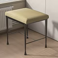 Beige Padded Sofa Stool With Metal Legs Placed In Wooden Floor Room Corner Near Radiator