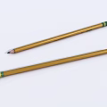 Two Golden Pencils With Green Accents Placed On White Background Surface