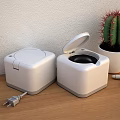 White Square Medical Devices With Open Lid And Black Interior On Wooden Tabletop