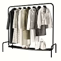 Fashionable Clothes Hanging On Black Rack With Coats Dresses Shoes And Bags