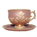 Elegant Copper Teacup With Gold Accents And Intricate Floral Saucer Design