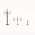 Different Style Candle Holders With Tall Red And Small Metal Stands