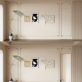 Elegant Beige Paneled Background Wall With Decorative Frames And Green Potted Plant