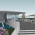 Modern Café Building With Lush Greenery Purple Flowers And Outdoor Seating Area