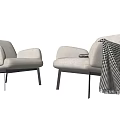 Modern White Single Sofa With Black Legs And Black And White Checkered Blanket