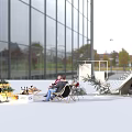Outdoor Commercial Event Equipment With Tent Structure Seating And Plants Near Modern Glass Building