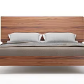 Modern Walnut Wooden Double Bed With Gray Pillows And Simple Design