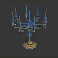 Ornate Gold Candelabra With Multiple Candle Holders And Decorative Flower Accent
