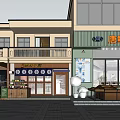 Modern Commercial Storefront Design With Glass Doors Varied Signage And Outdoor Greenery